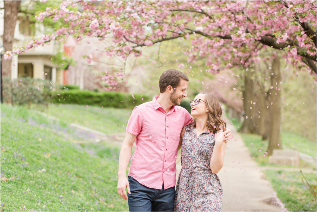 Spring-Falling-Petals-Pink-Blooms-Louisville-Highlands-Engagement-Session
