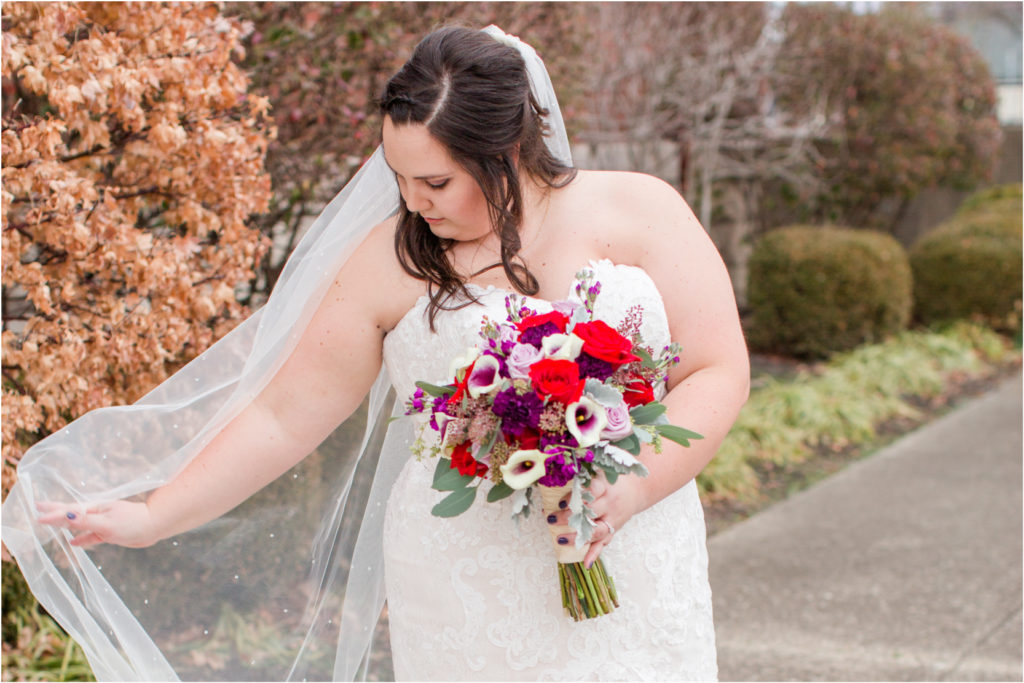 Bride Portraits Bud's in bloom florals red and purple winter bouquet