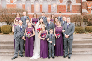 large wedding party in purple and gray